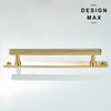 Decorative brass cabinet pull with gleaming polished finish and backplate

