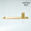 Close-up of polished brass knurled cabinet knob with gold backplate

