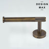 Brushed brass toilet paper holder with anti-slip end cap on a clean white studio background.