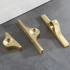 Modern brass cabinet knobs with a brushed nickel finish, creating a sleek and contemporary look.
