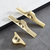 Unique brass cabinet knobs with a geometric design, adding a touch of personality to your space.
