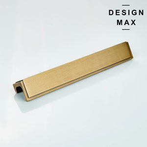 Close-up of aged gold brass finger pull with brushed finish for modern cabinets