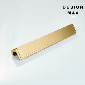 Top-down angle showing ergonomic finger grip design of gold cabinet pull
