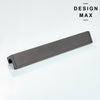 Flat lay of brass finger pull next to matching cabinet knobs and hinges
