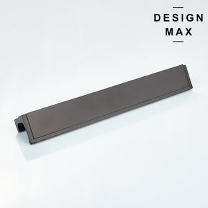 Flat lay of brass finger pull next to matching cabinet knobs and hinges