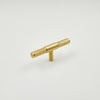 Sleek brass cabinet hardware with a minimalist design