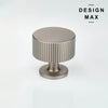 Knurled brass knobs offering a textured grip and a refined, industrial appearance
 