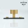 Close-up of Marlowe brass knob with vertical stripes and black base plate

