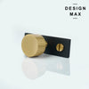 Decorative brass striped knob with contemporary black backplate

