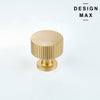 Extreme close-up of unlacquered brass knob developing natural patina over time