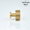 Marlowe brass knobs installed on white shaker cabinets in farmhouse kitchen