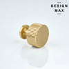 Glass-front display cabinet with elegant brass knobs in retail boutique
