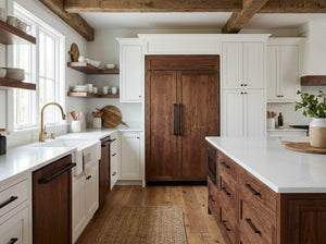 Modern kitchen with wooden refrigerator, white countertops, and wooden beams.
