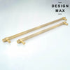 A set of modern appliance handles in a muted matte brass finish featuring a distinct textured surface for grip.