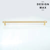 Modern kitchen hardware: two matte brass appliance pulls with a cylindrical shape and a finely textured surface. 