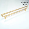 Two textured cylindrical handles in a matte brass color, designed as pulls for large kitchen appliances like refrigerators and dishwashers. 