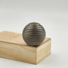 Modern brass cabinet knobs with a brushed nickel finish, creating a sleek and contemporary look.