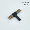 Matte black cabinetry with contrasting brass T-knobs creating bold visual impact