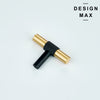 Tecton brass T-pull installed on gray kitchen cabinets in contemporary home