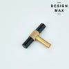 Black matte pantry door with contrasting unlacquered brass T-knob for dramatic effect